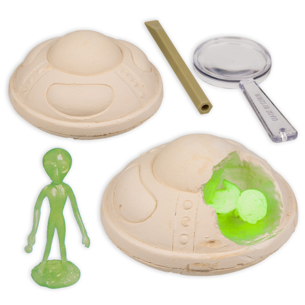 Alien Ausgrabungs-Spiel mit UFO-Gipsblock und leuchtendem Alien